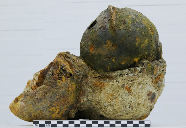 Fragmentary iron helmet with traces of paint and patina